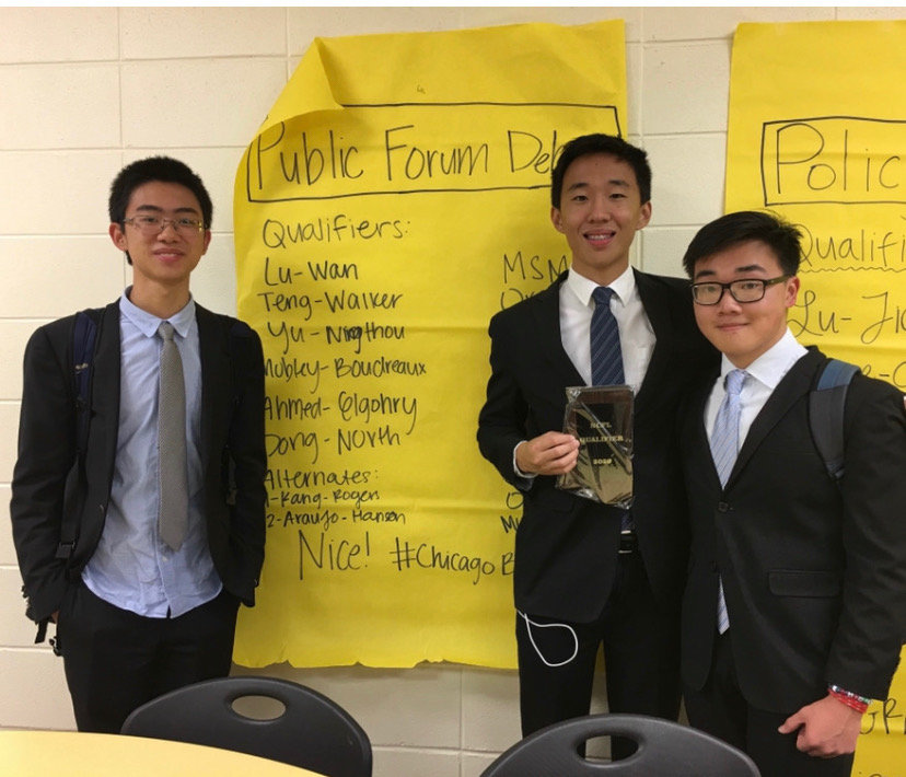 Michael Lu (second from right) and Aaron Wan (far right) were both recognized as Academic All-Americans by the National Speech and Debate Association.