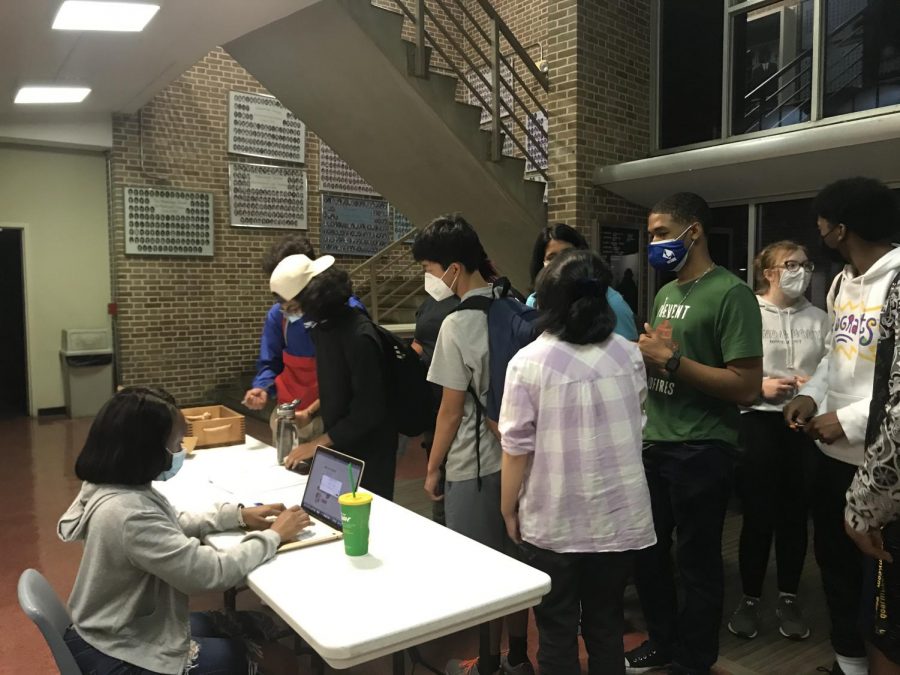 Students wait to enter their names for a chance at winning the Weekly Wednesday Door Prize.