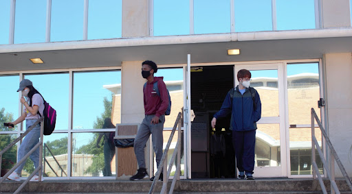 Seniors Jessica Yan, Anthom Ahanomu and Nathan Guy leave Hooper after a day full of rigorous classwork.