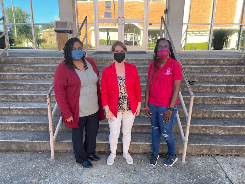 Director for Student Affairs LeAnn Alexander, Director for Academic Affairs Clear Moore and Bledsoe wear red in support of a drug-free lifestyle.