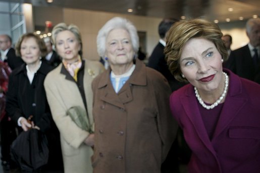 Rosalynn Carter, Hillary Clinton, Barbara Bush, and Laura Bush, four First Ladies of the United States, meet together for an event.