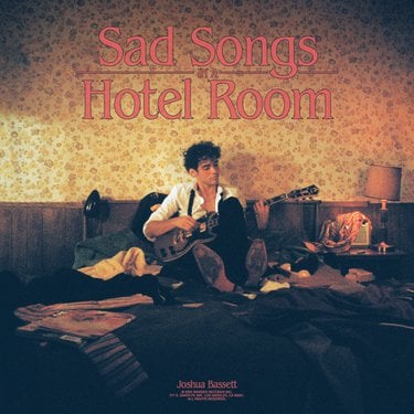 Joshua Basset's latest musical release Sad Songs in  a Hotel Room is a sure symbol of his soft indie-pop style.