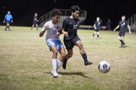 Senior Jeremy Padilla (right) battles with a Booneville player during a game.