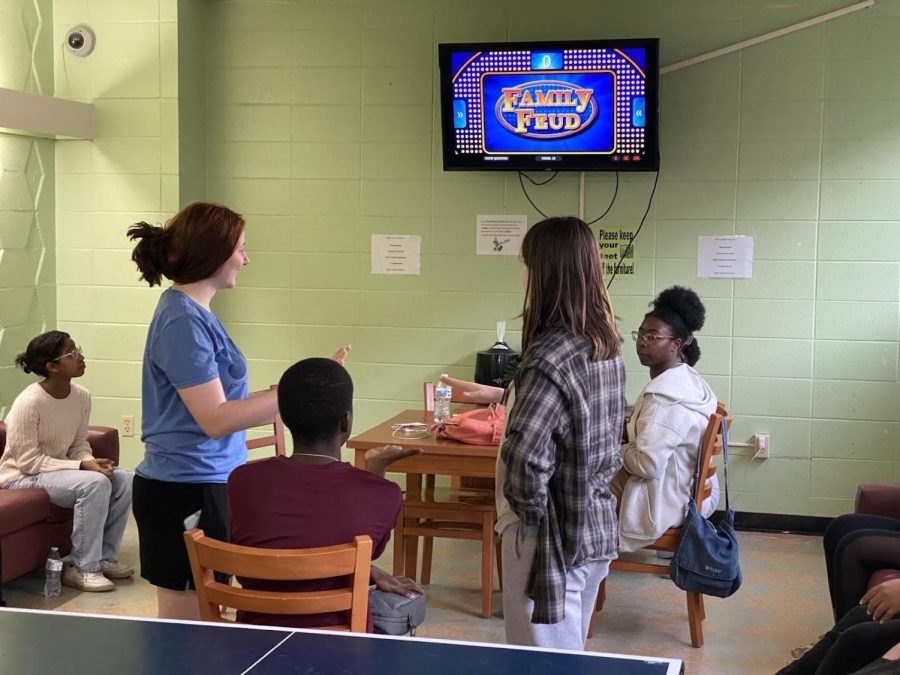 MSMS juniors Sabrina Simms (left) and Victoria West stand in front of junior Jeremy Hathorn as they compete in a friendly game of Family Feud in Frazer lobby on March 7. 