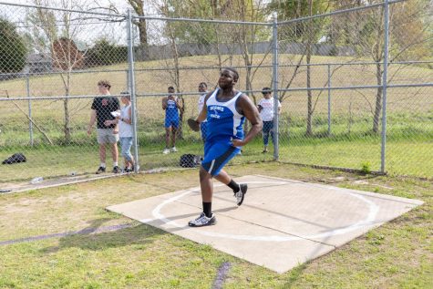 Senior Jatarious Lang participates in shot put competition on April 4. With a 38 feet and 7 inch distance, Lang went home with the second place title. 