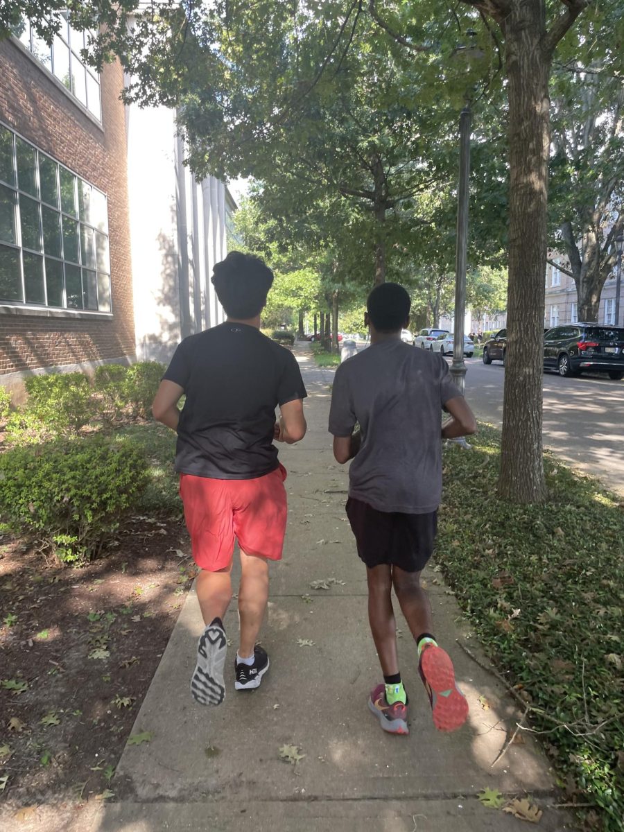 Senior cross-country team members Ean Choi (left) and Roman Luckett practice in preparation for the upcoming meet. The team travels to Mooreville High School on Sept. 9 for the next competition.