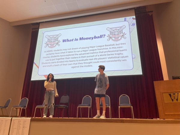 Senior Lucianna Marquez and junior Sean Stewart present their Moneyball Special Topics class. Students presented class projects at the end of Special Topics Week at the Special Topics Exposition.