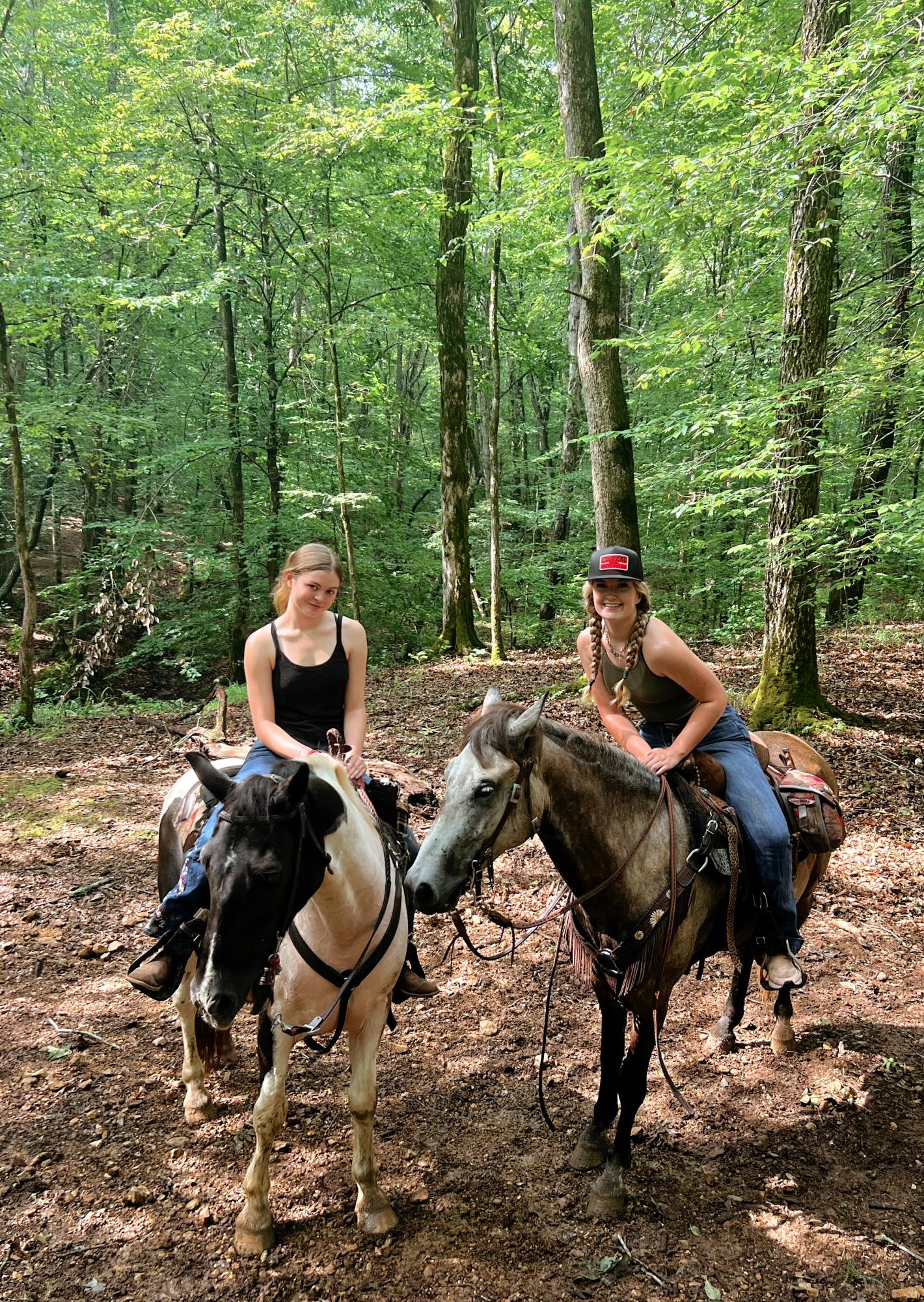 Juniors Allison Krieger (pictured left) and Sarah Irvin ride on horseback ride on their trip in Tennessee. 