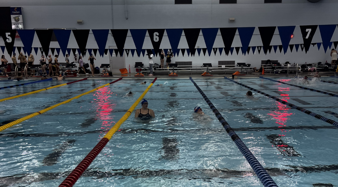 Juniors+Ava+%28left%29+and+Alex+Bodmer+swim+at+the+first+swim+meet+of+the+season+on+Sept.+5+in+Tupelo.+Both+swimmers+qualified+for+North+Half+on+Oct.+14.