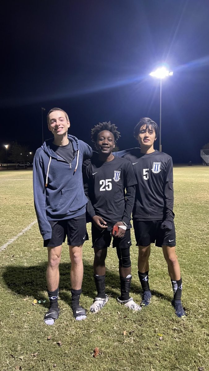 Senior Sebastian Harvey, junior Ngoh Mobit and senior Ethan Liao pose after their 4-1 scrimmage win against Grenada High School. Each of them scored one goal, and the fourth goal was an own goal by Grenada.