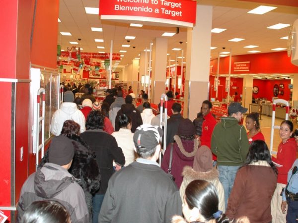 Shoppers line up outside Target for Black Friday deals in 2008. Holiday hypercapitalism influences not only our shopping habits but also the festive celebrations we know and love. 