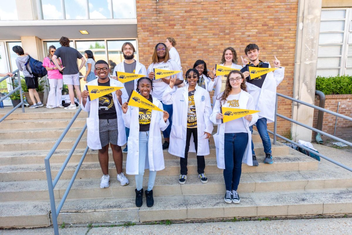 MSMS students who will attend the University of Southern Mississippi pose together on May 1s College Reveal Day. In the back row, from left to right, Maxim Chamberlin, Dorothy Virges, Tyniandra Redmond, Natalie Holifield and Colton Cleary stand. In the front row, from left to right, Gavin Weatherspoon, Myia Williams, Keyonna Griffin and Ava Dedwylder stand.