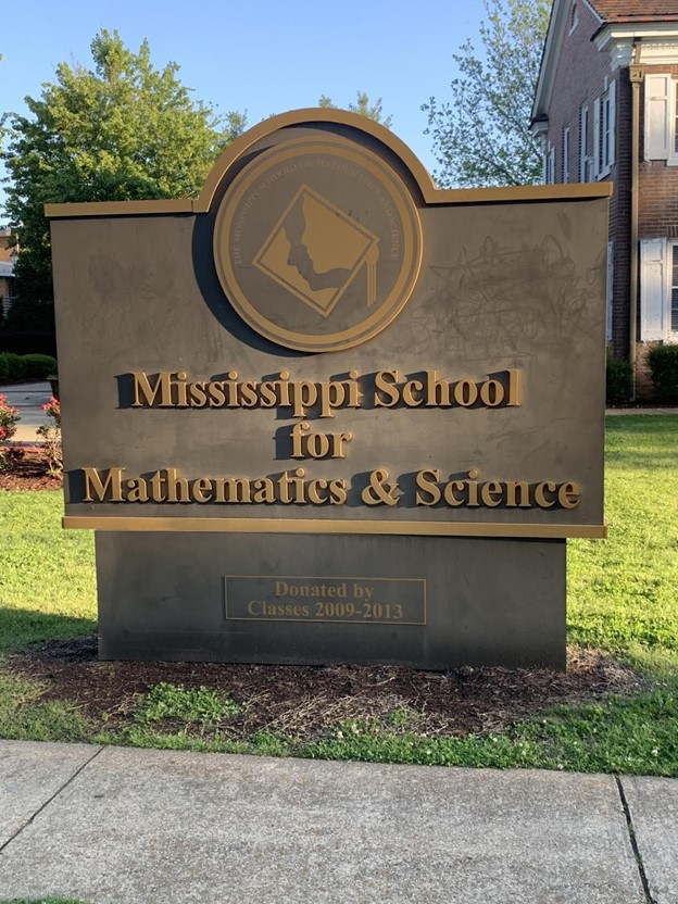 The Mississippi School for Mathematics and Science sign stands in front of Mary Wilson, home to administration at MSMS. 
 Juniors reflect on their first-year experience.