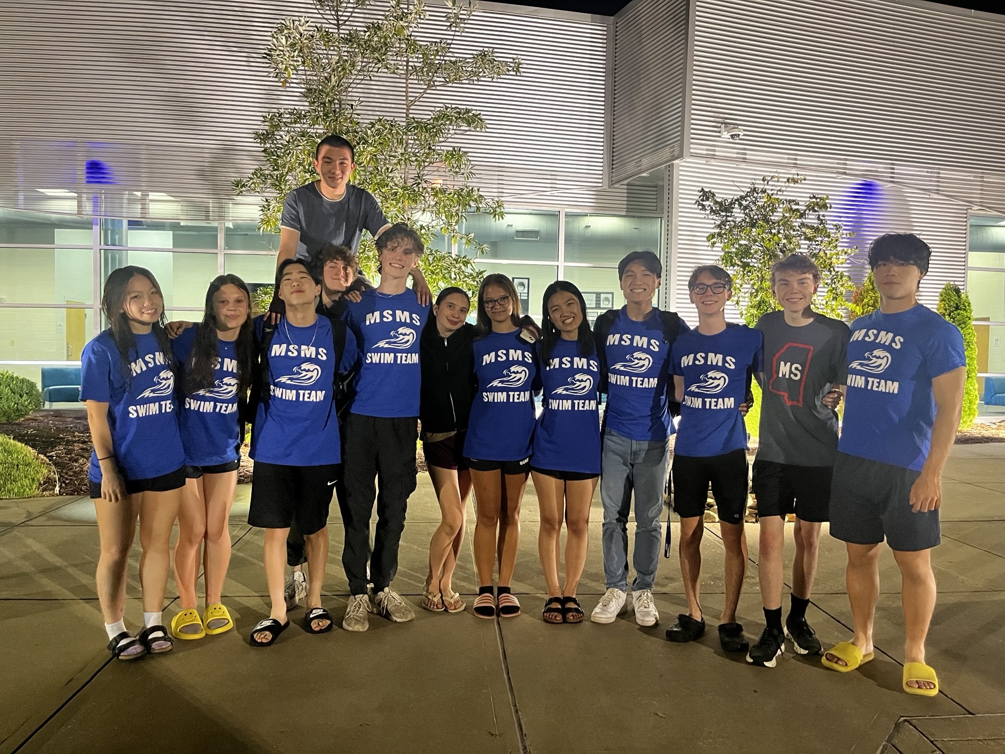 Swimmers pose in front of Tupelo Aquatic Center on Sept. 24. The MSMS swim team secured numerous qualifications for North Half.