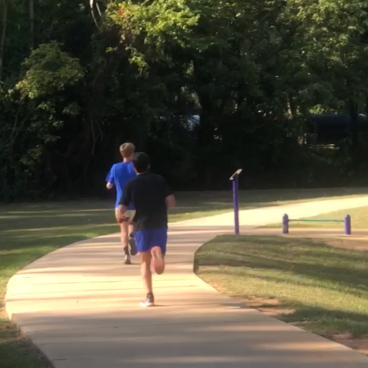 Senior captains Lucas Sloan (front) and Lucas Griffith practice for the new season. The team will travel to Mooreville High School on Sept. 14 for their next meet.