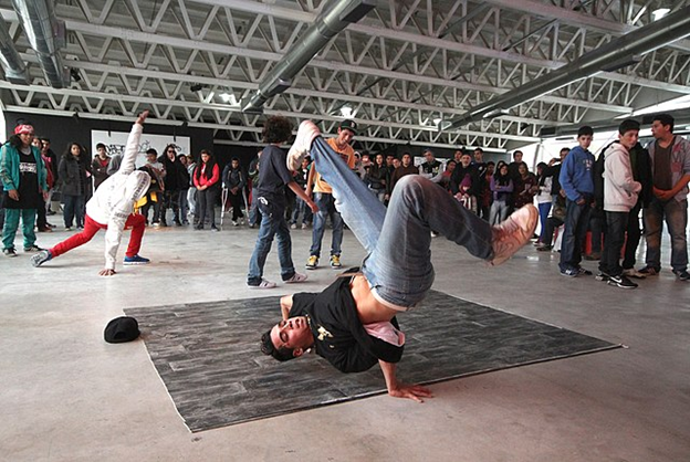 Breakdancing became an international sensation after Michael Jackson's popularization and is characterized by dynamic moves that take inspiration from gymnastics and martial arts.