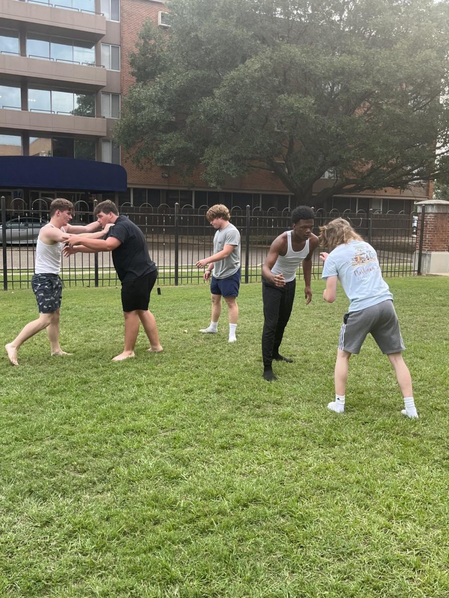 Lead by junior Shaw Prewitt, Enoch Clardy wrestles against Jesse Shelton (left) and Aiden Holifield wrestles against Ross Chism at the Stark Recreation Center. 