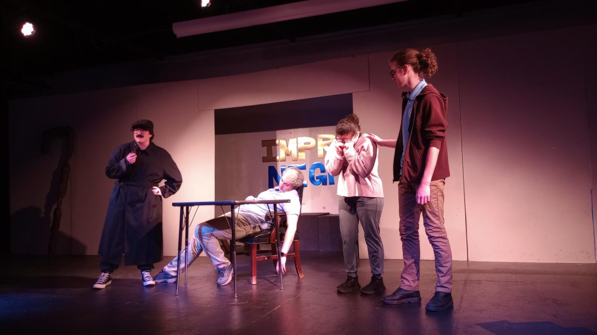 From left to right:  Drama Club performers Evan Burgoyne, Lilly Adcock, Belsy Soto and Ben Breeden act in "The Death of Mr. Yarborough."