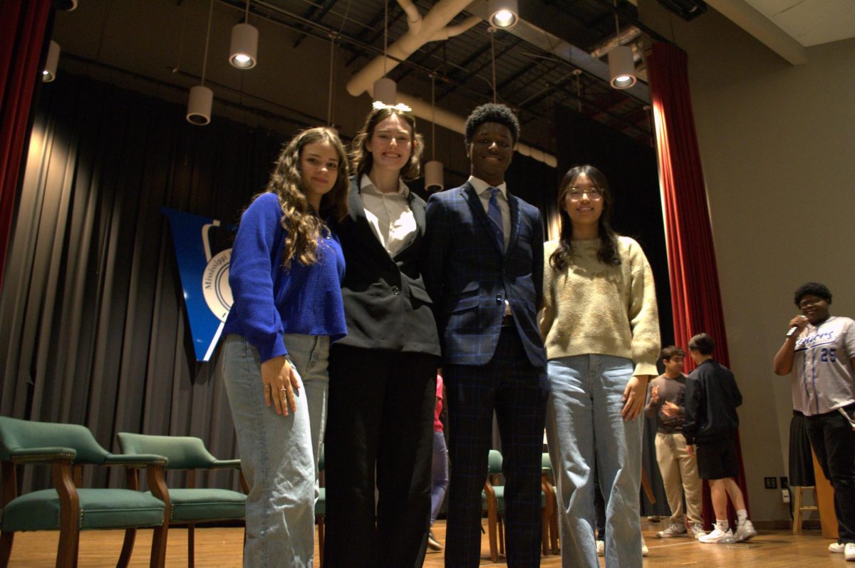 From left to right, Junior Class Historian Sophia Dean, Treasurer Poppy Bowling, Secretary Vincent Young and Vice President Rebecca Sun pose together in Nissan Auditorium after election results were announced on Oct. 24. President Nina Weinstein is not pictured.
