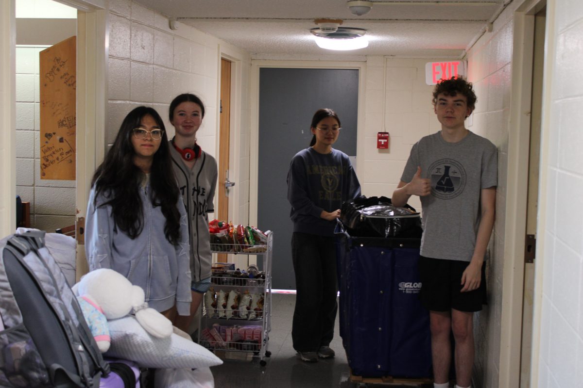  From left to right: juniors Luisa Ramirez Sanchez, Carmen Wooley, Jimin Kim and Ren Mccaleb move items out of their rooms in Jones Hall.