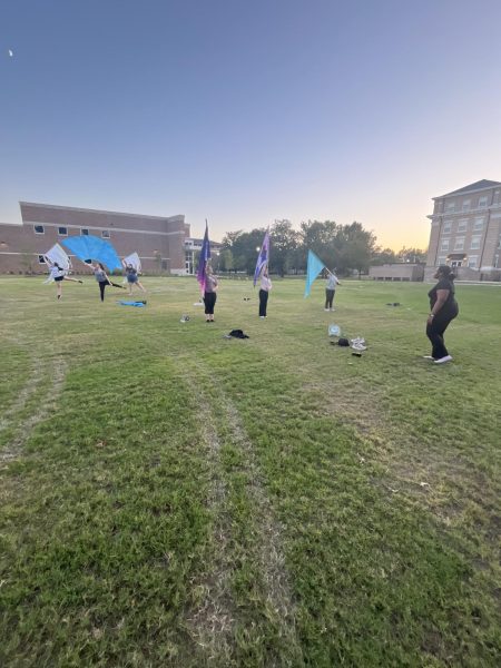 Color Guard Vice President Jolanna Jackson leads new club members at beginning practice.