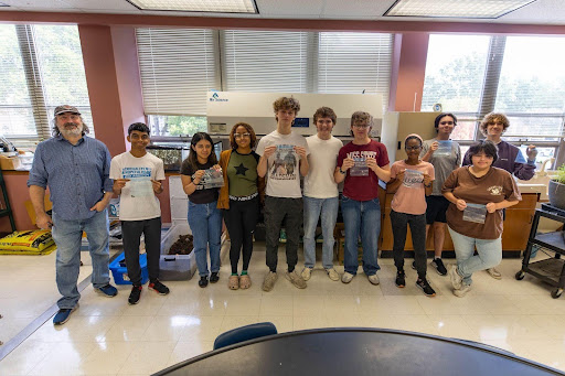 Pictured from left to right: biology faculty Jason Palagi and students Mervyn Thankachan, Dennys Flores, Jazmyn Banks, Max Thompson, Mason Hill, Jack Kirkland, Syrena Thornton, Carter Scaggs, Lee Faul and Charlie Elliott pose with their experimented seeds, which will be launched into space through NASA’s Solar System Ambassadors program on Oct. 19.
