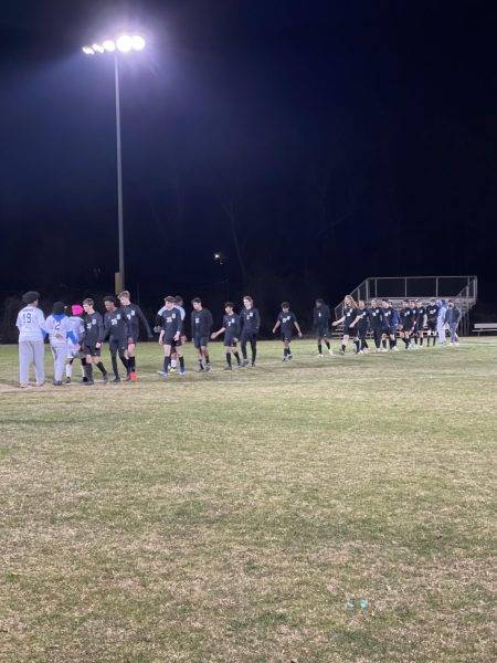 The Frazer team exchanges handshakes with Kemper Country postgame on Jan. 19, Senior Night, after a victory.