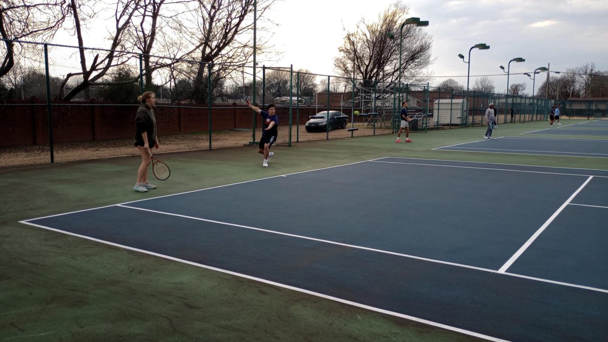 Junior Anderson Chaney and senior Nora Scott prepare for the upcoming season at the MUW tennis courts.