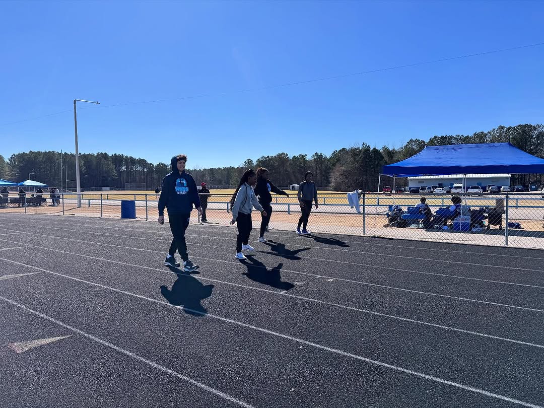 From left to right: Nolan Clark, Tanilya Clark, Tenea Smith and Syrena Thornton prepare for the Tishomingo County High School meet on Feb. 24.