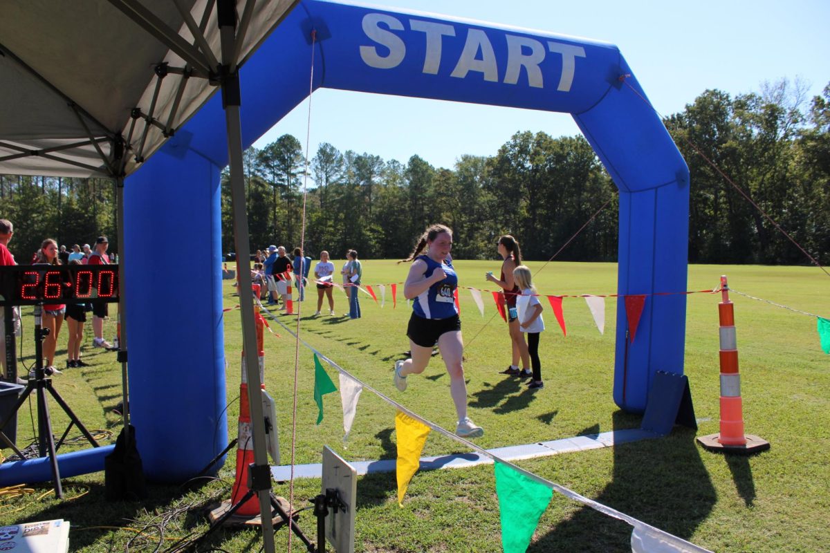 Senior Nina Weinstein crosses the finish line at South Pontotoc High School finishing 34th in the girls' 3-mile run with a time of 25:59.92.