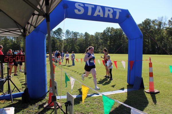 Senior Nina Weinstein crosses the finish line at South Pontotoc High School finishing 34th in the girls' 3-mile run with a time of 25:59.92.