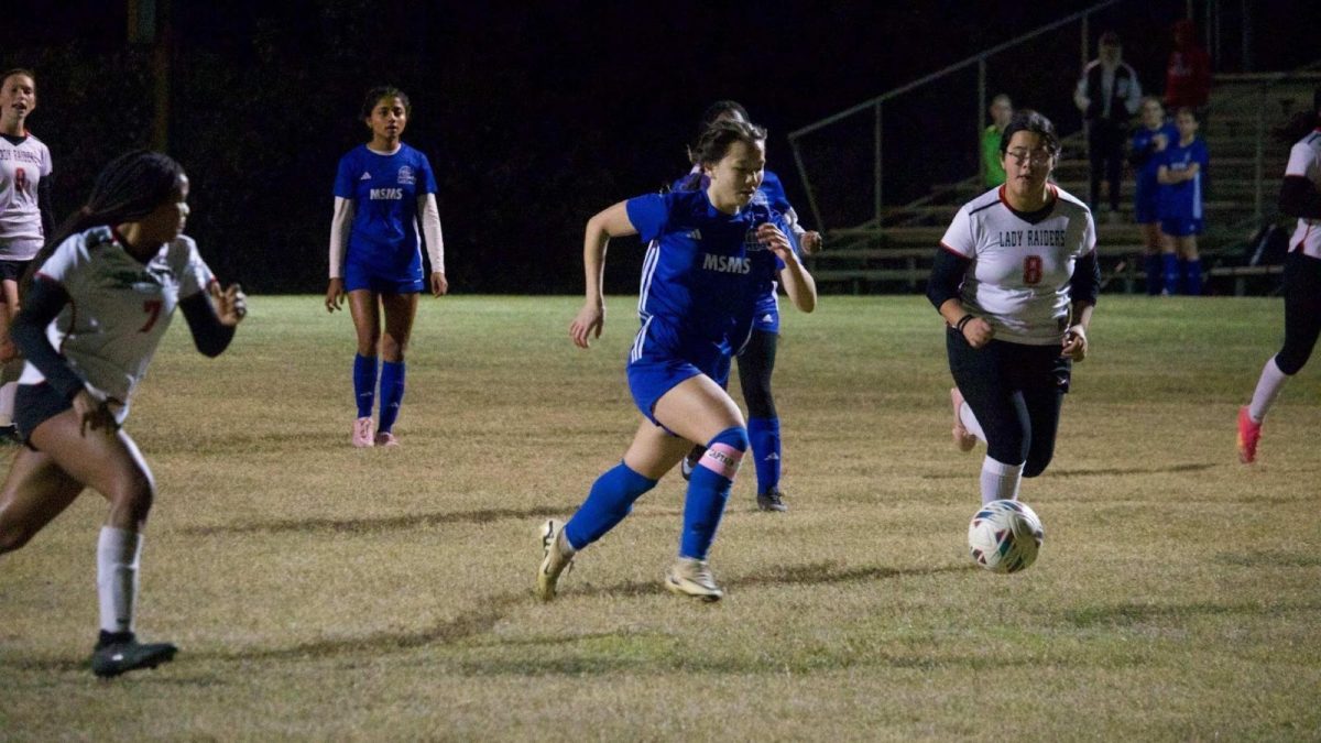 Senior Isabel Beckman takes the ball.