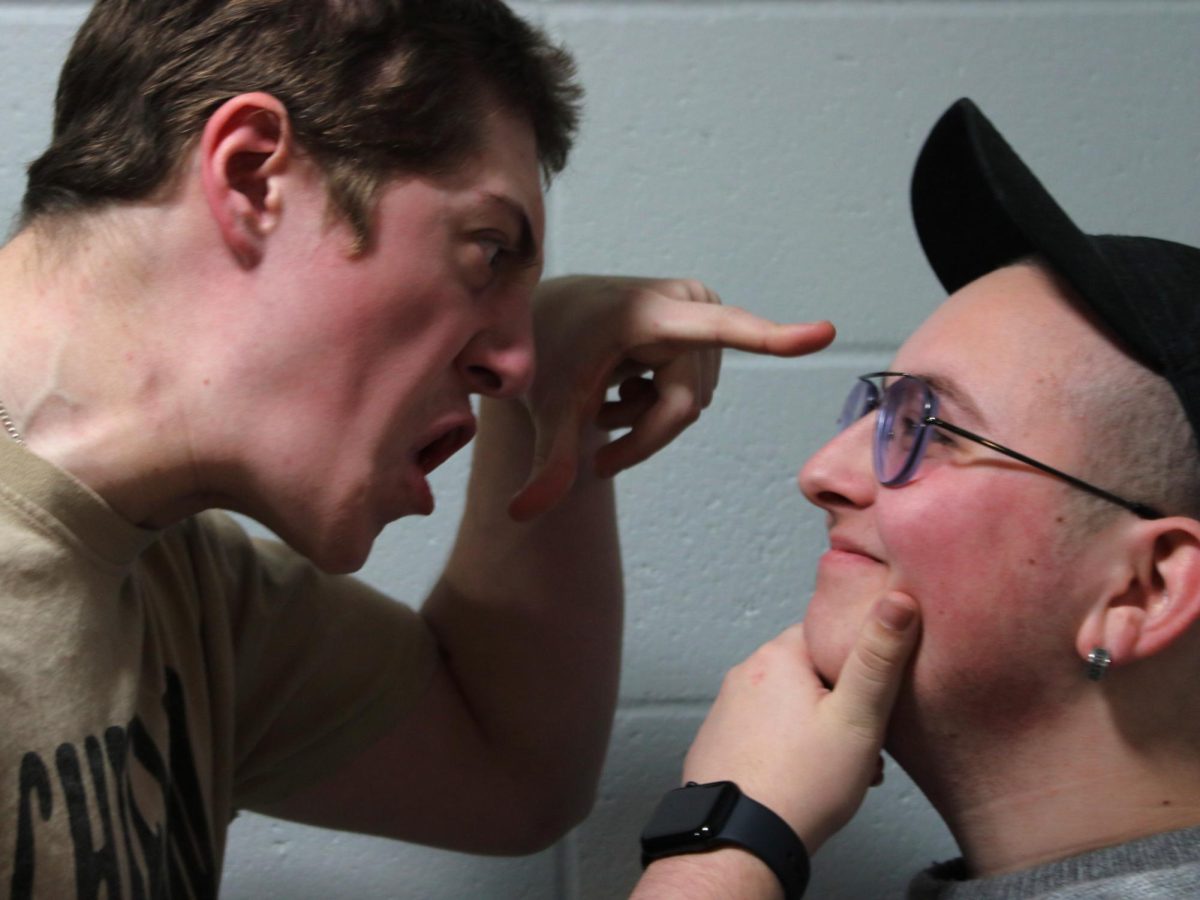 Rage-baited senior Nicolas Palagi yells at calm senior Landon Rymer. Photo illustration by Raymond Yang. 