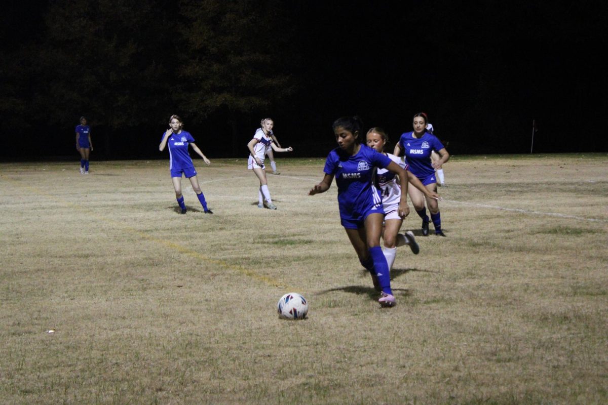 Senior Aanya Banga advances the ball in Goen's 2-1 victory against Nettleton on Nov. 18.