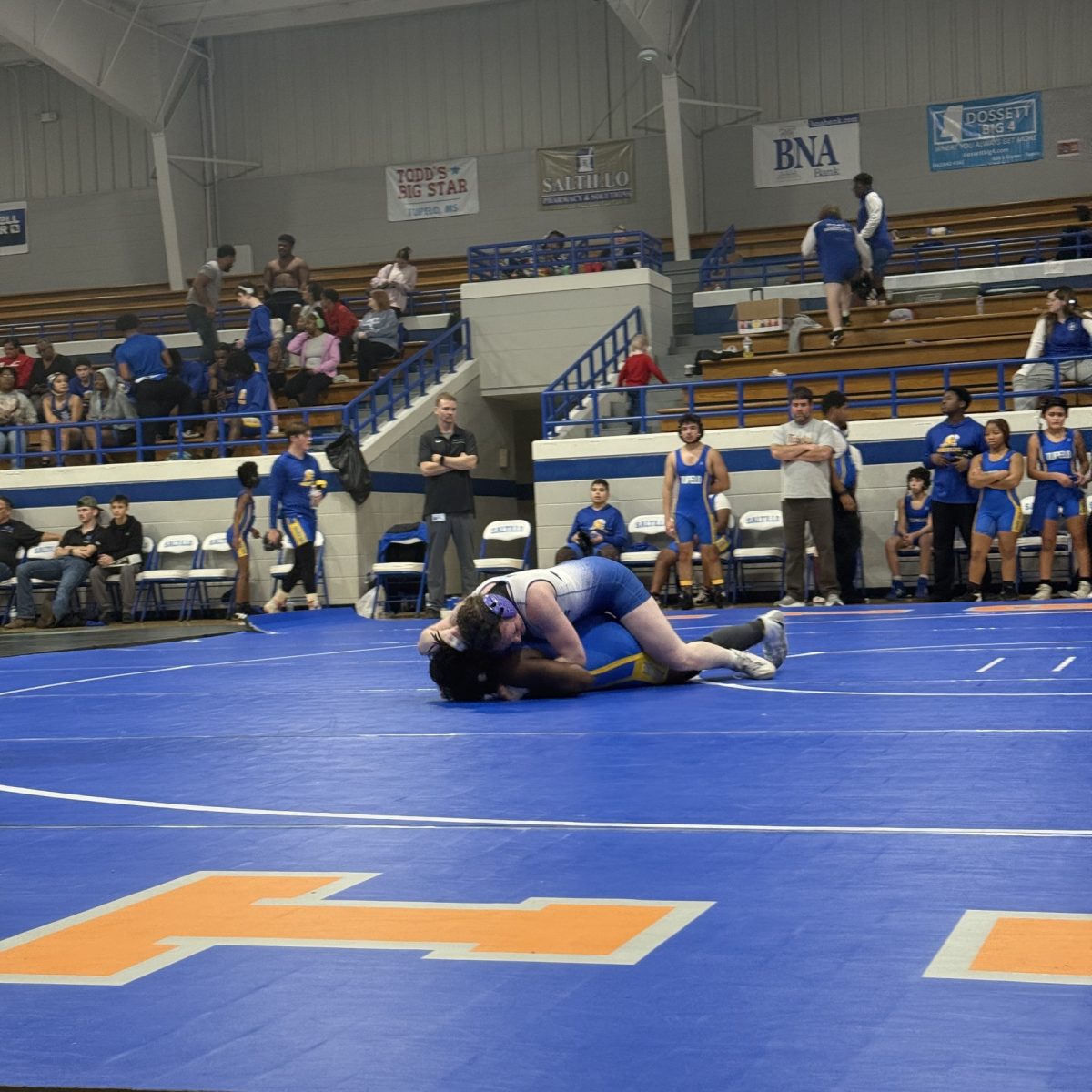 Co-captain Nina Weinstein pins her opponent from Tupelo High School to the ground at the Jan. 8 quad match in Saltillo.