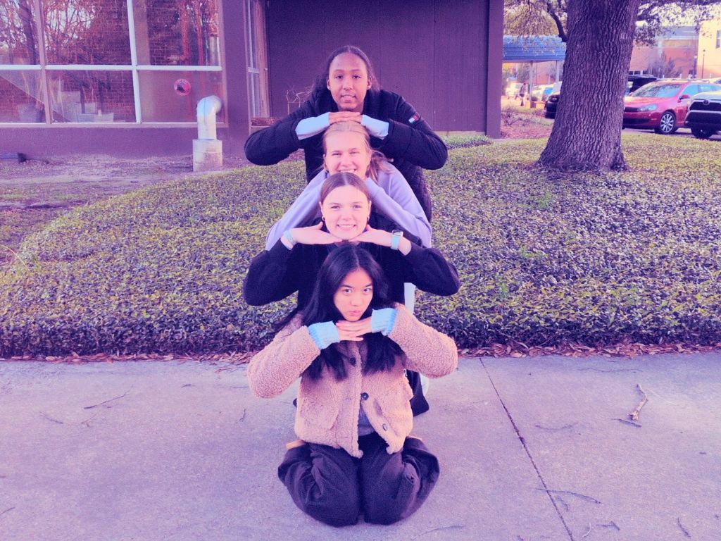 Top to bottom, students Jordan Taylor, Cecelia Buehler, Sonora Foster, and Angelina Tan pose for a photo using a Snapchat filter that imitates the 2016 trend.