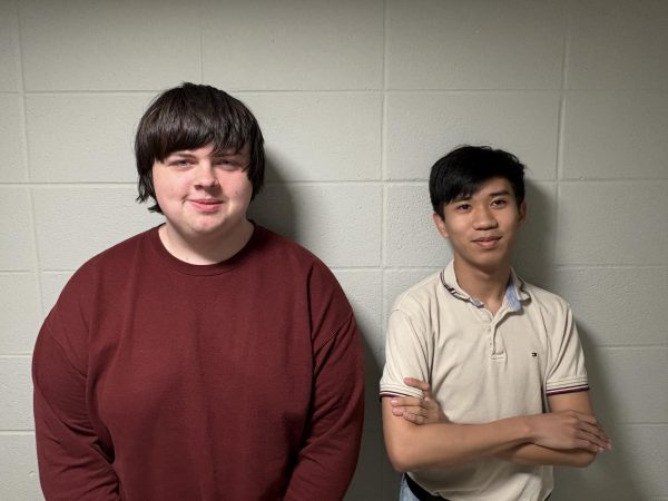 Kade Chambers (left) and Minh Nguyen won the inaugural award for best overall resolution at the annual Mississippi Model Security Council Conference in March.