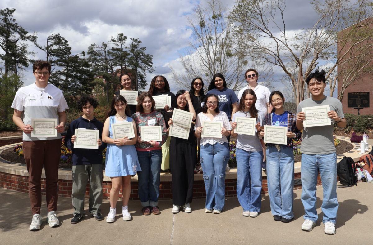 Staff members of the Vision with their awards at the Mississippi Scholastic Press Association conference in Oxford on March 31. First row from left: Walt Giesen, Jake Heisler, Harper Hipp, Margot Hoffman, Rebecca Sun, Bea Storment, Cassie van Riessen, Claire Rhee and Raymond Yang. Second row from left: Cathy Shao, Aundriya Neely, Katie Chung, Anya Rai and Landon Rymer.